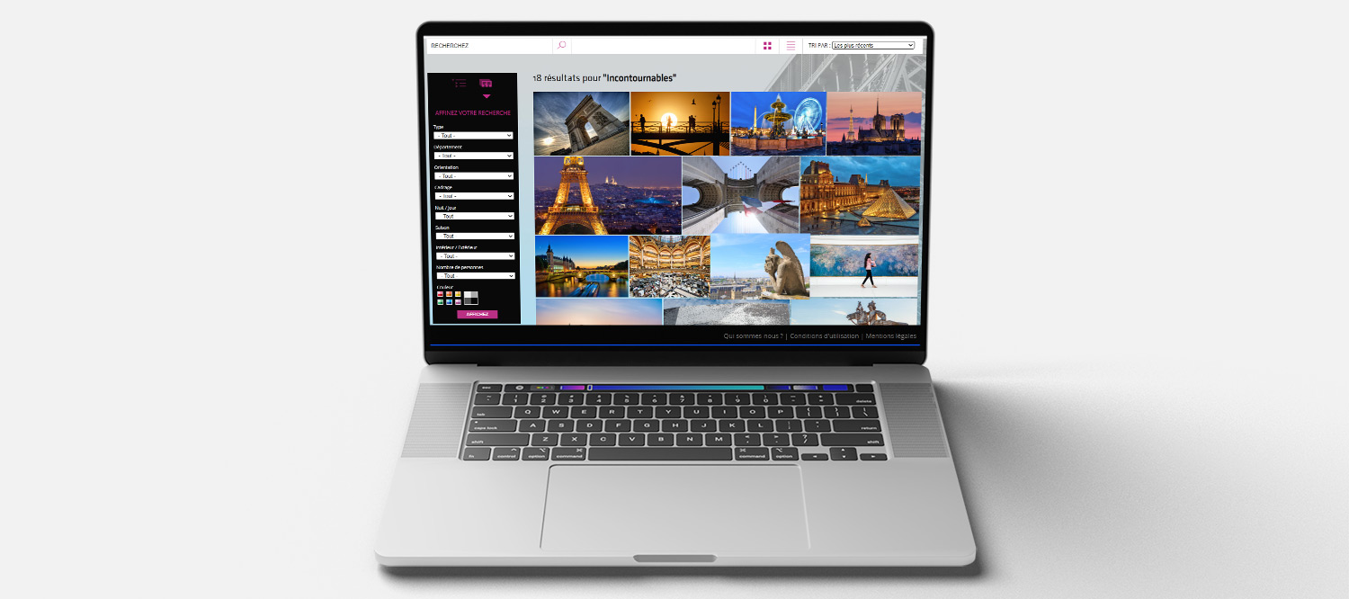 Ordinateur Mac montrant une capture d'écran de la médiathèque du Comité Régional du Tourisme Paris Ile-de-France