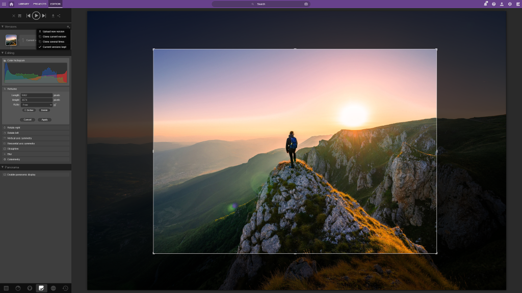 Screenshot of Ephoto Dam with the cropping function in use. You can also see the colour histogram and version management.