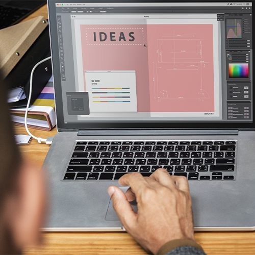 People working on their computer using Photoshop